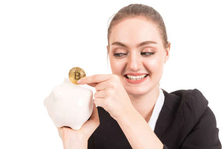 Businesswoman holding golden bitcoin in her hand isolated on white background