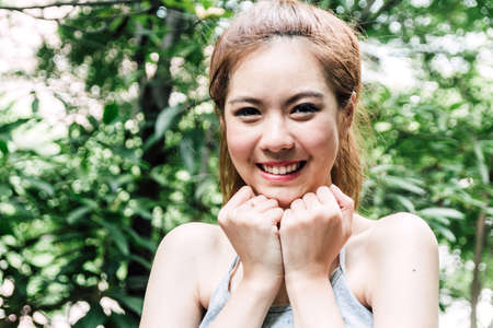 Young smiling woman relax and enjoying with copy space on natural morning fresh air background