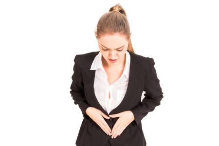 Businesswoman having painful stomach ache isolated on white backgroundの写真素材