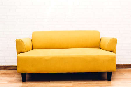 Interior sofa furniture decoration on white brick wall backgroundの写真素材