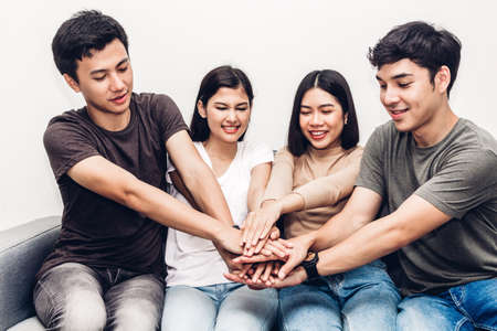 Successful of group of friends stack of hands together.Friendship teamwork conceptの写真素材