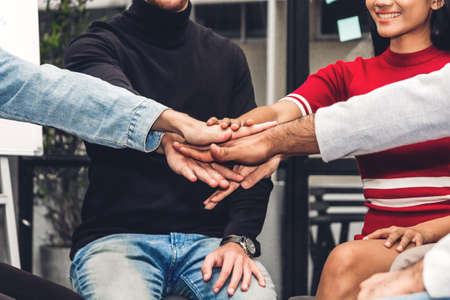 Successful of group business people stack and putting their hands together at office.Friendship...