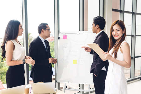 Group of casual business discussing and working with laptop computer.creative business people planning and brainstorm in modern workloft.Teamwork conceptの写真素材