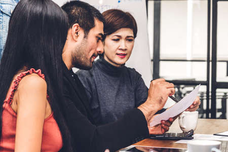 Group of casual business discussing and working with laptop computer.creative business people planning and brainstorm in modern workloft.Teamwork conceptの写真素材