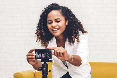 African american woman blogger in front of camera recording herself.social media conceptの写真素材