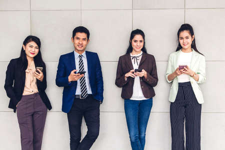 Group of business relax use technology together of smartphone  checking social apps and working.Communication conceptの写真素材