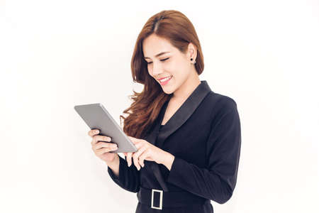 Portrait of smiling business woman holding a tablet computer isolated on white background