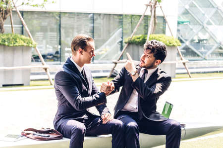 Image two business partners in elegant suit successful handshake  together in modern office.Partnership approval and thanks gesture conceptの写真素材