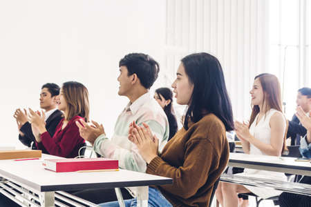 Successful of group student clapping hands  in classroomの写真素材