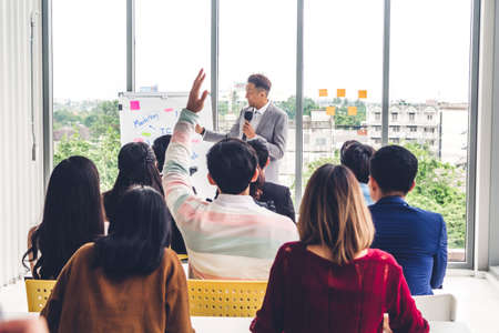 Businessman standing in front of group of people in consulting meeting conference seminar at hall or seminar room.presentation and coaching conceptの写真素材