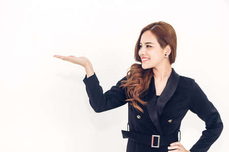 Woman showing empty copy space on open hand isolated on white background
