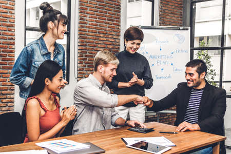 Successful of group business people fist bump together  at office.success mission team meeting.Friendship teamwork conceptの写真素材