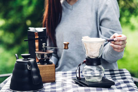 Woman stretching happy and relaxed after wake up in the morning at homeの写真素材