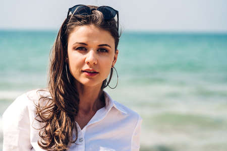 Portrait of smiling woman relaxation in red bikini on the tropical beach.Summer vacations