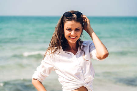 Portrait of smiling woman relaxation on the tropical beach.Summer vacations