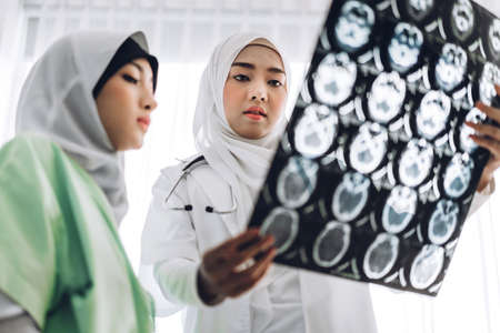 Success of handshake two muslim asian female doctor in hospital.healthcare and medicine