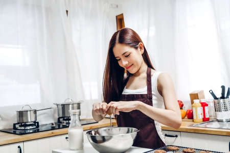 Portrait woman enjoy and relax on the bed in bedroom at home.asian beautyの写真素材