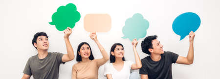 Group of friends holding a speech bubble iconの写真素材