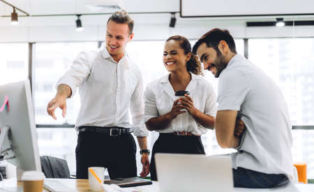 Group of professional business meeting and discussing strategy with new startup project.Creative business people planning and brainstorm with document report in modern workloft.Teamwork conceptの写真素材