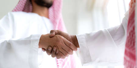 Successful of arab business partner handshake together in modern office.Partnership approval and thanks gesture conceptの写真素材