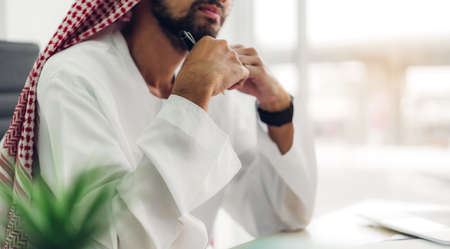 Arabic businessman working with laptop computer.creative arab business people planning at modern work loftの写真素材