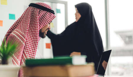 Arabic businessman working with laptop computer.creative arab business people planning at modern work loftの写真素材