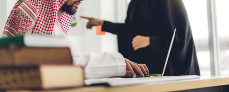 Arabic businessman working with laptop computer.creative arab business people planning at modern work loftの写真素材