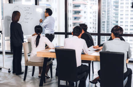 Group of professional business meeting and discussing strategy management with new startup project.Creative business people planning and brainstorm with document report in modern workloft.Teamwork conceptの写真素材