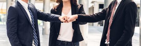 Businessman and partner giving fist bump handの写真素材