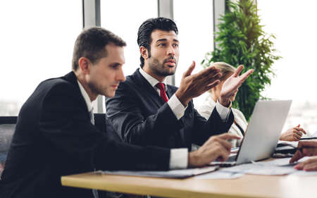 Group of professional business meeting and discussing strategy with new startup project on laptop computer.Creative business people management planning and brainstorm with document report in modern workloft.Teamwork conceptの写真素材