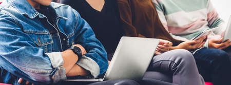Group of friend sitting relax use technology together of laptop and tablet checking social apps and work.Communication conceptの写真素材
