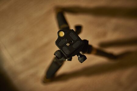 Tripod on the background of the laminate. Luxury tripod and laminate flooring.の写真素材