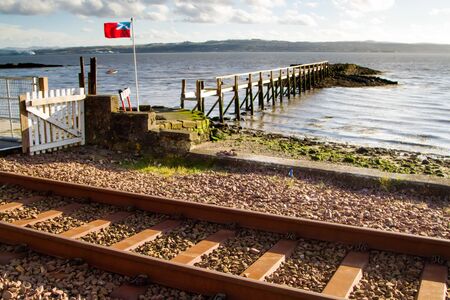 Scottish Flag blowing on Culross Pier, Fifeの写真素材