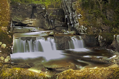 Beautiful and mysterious waterfall in Callander Scotlandの写真素材