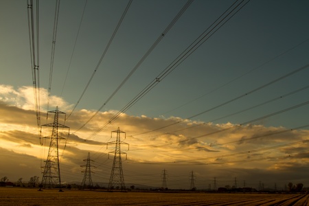 Shot of Electricity Pylons at Sunset in Scotlandの写真素材