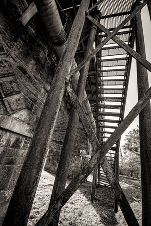 A shot of Steel stairs on a rail bridgeの写真素材
