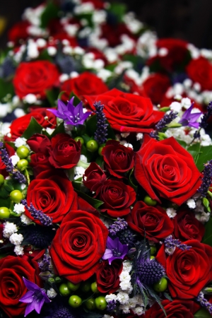 A close detailed shot of red roses in a floral bouquetの写真素材