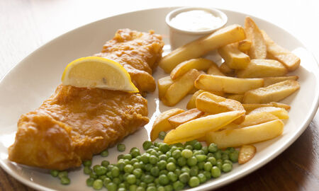 A shot of delicious Fish chips & peasの写真素材