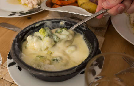 Healthy takeaway Broccoli whit cheese sauceの写真素材