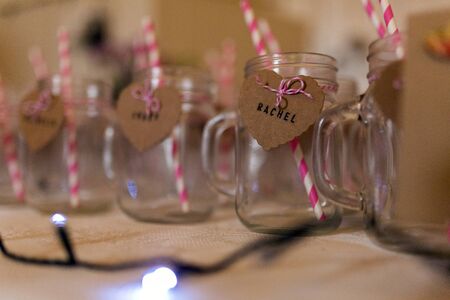 A Funky drinking glass with stripey strawsの写真素材