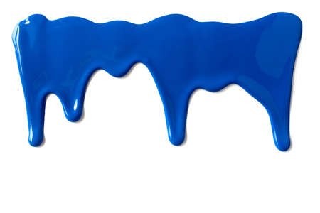 Blue paint leaking down white background. Close up.の写真素材