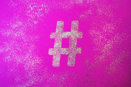 Hashtag sign. Silver hashtag symbol on trendy pink backgroundの写真素材