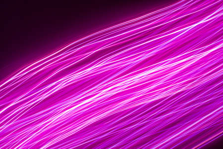 Moving neon lights abstract background. Long exposure shotの写真素材
