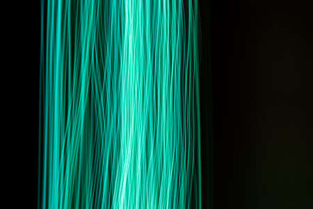 Moving neon lights abstract background. Long exposure shotの写真素材