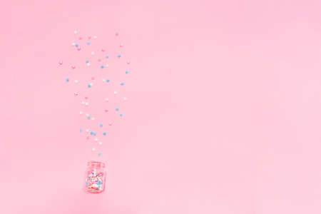 Little stars confetti on pink background. Holyday concept. Copy cpase for your text.の写真素材