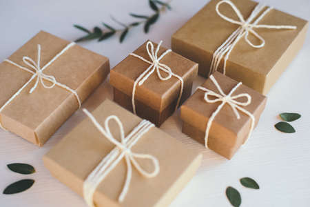 Craft gift boxes on white wooden background.の写真素材