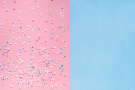 Little stars confetti on pink background. Holyday concept. Copy cpase for your text.の写真素材