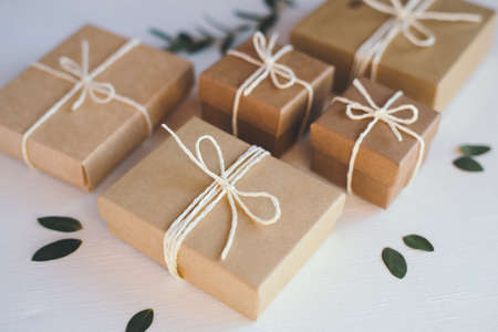Craft gift boxes on white wooden background.の写真素材