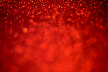 Red glitter christmas abstract background. Defocused sequin light.の写真素材