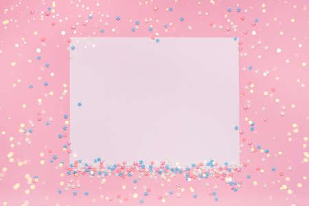 Little stars confetti on pink background. Holyday concept. Copy cpase for your text.の写真素材